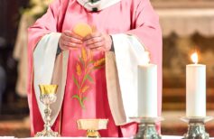 Priest giving Eucharist